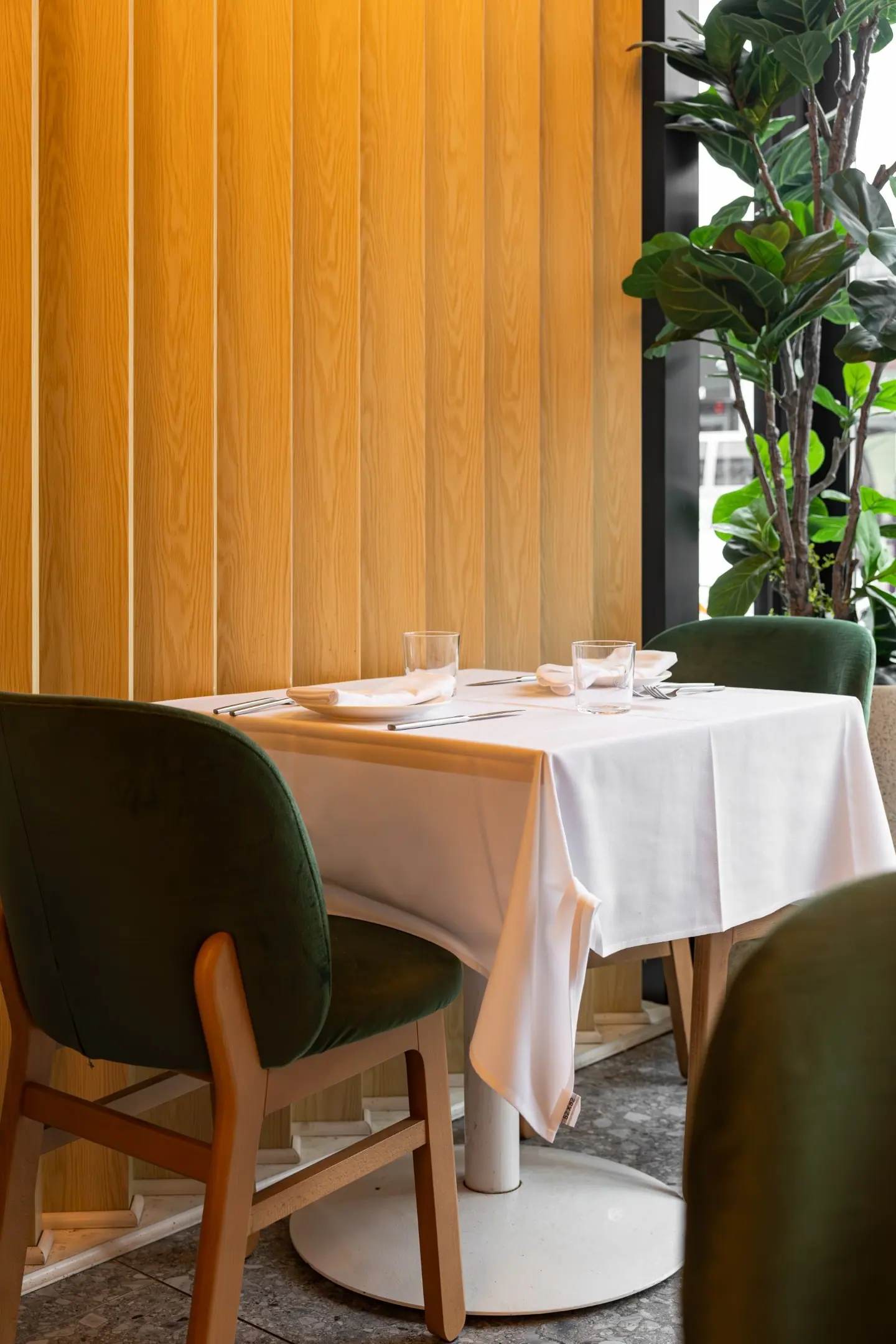A corner table set for the evening
